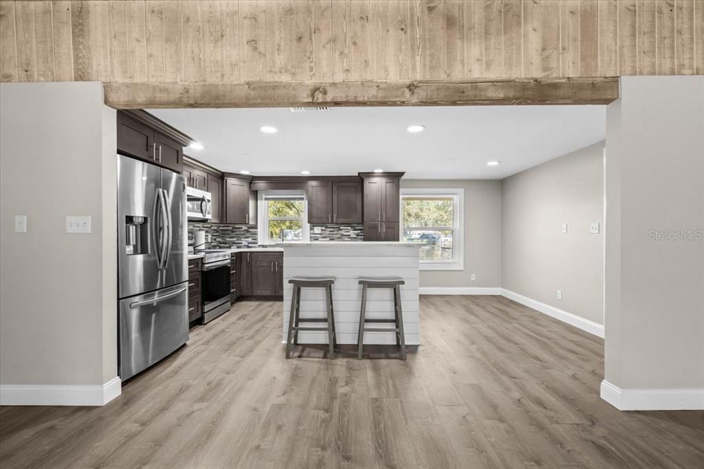 4805 Cooper Road Plant City, FL 33565 - Photo 39 of 45 a kitchen with refrigerator and cabinets