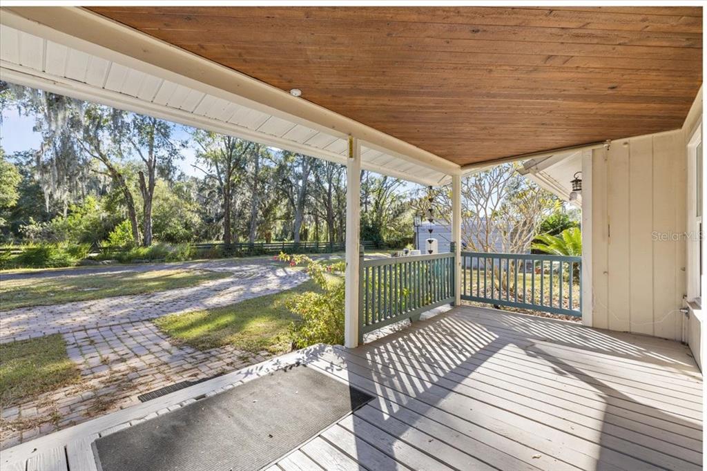 4805 Cooper Road Plant City, FL 33565 - Photo 4 of 45 a view of a patio with wooden floor