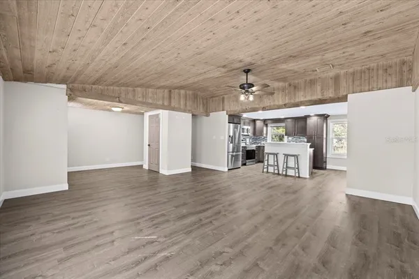 a view of a livingroom with wooden floor