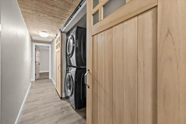 a view of a hallway with a white door