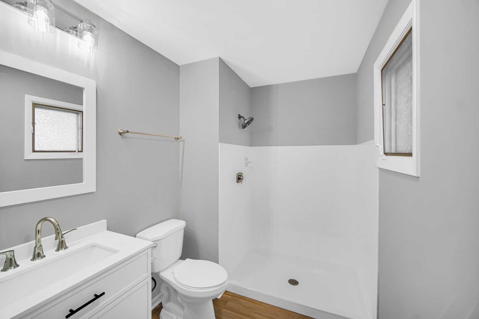 6827 Sussex Road Tinley Park, IL 60477 - Photo 11 of 27 a white toilet sitting next to a bathroom sink