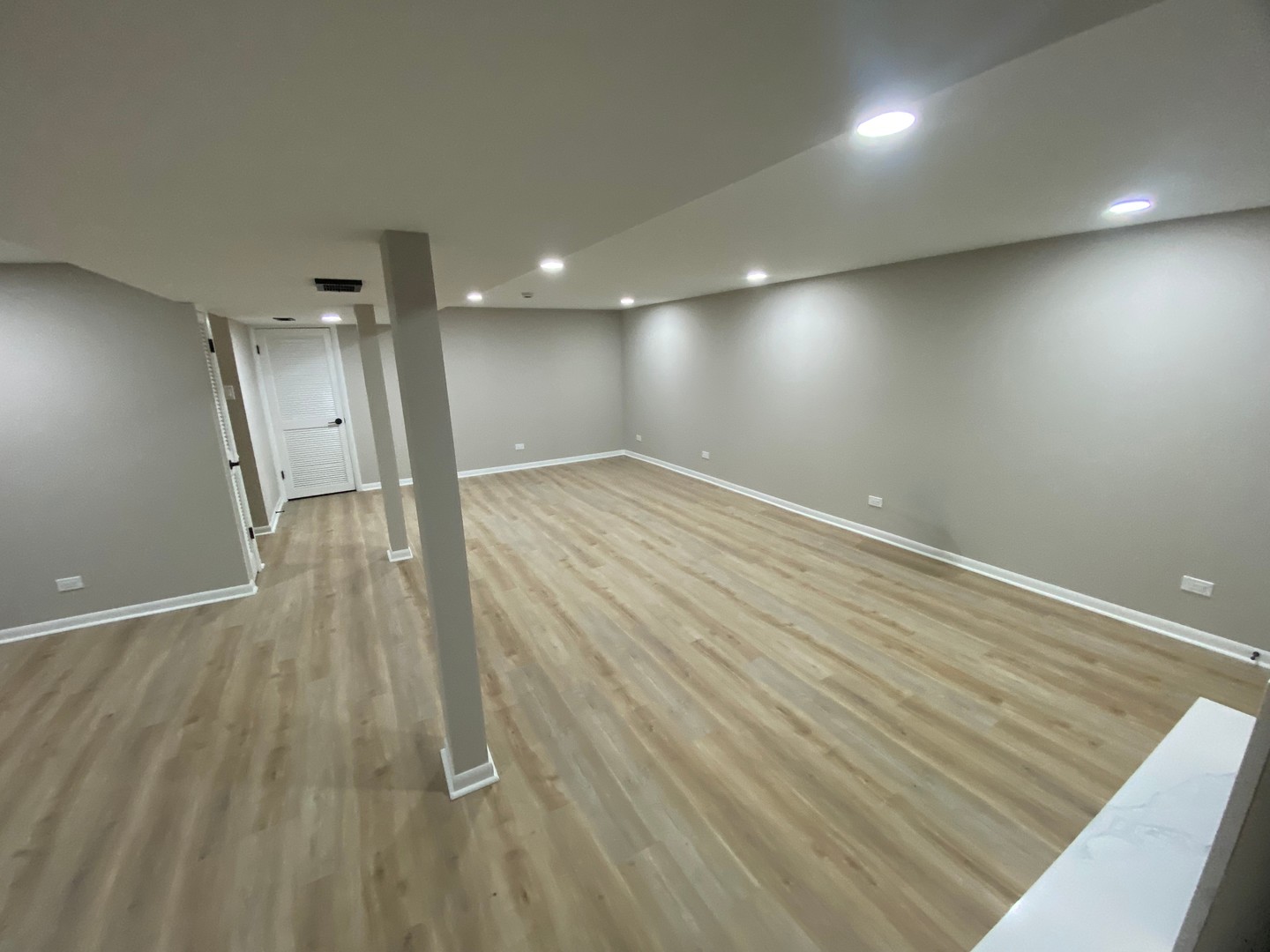 6827 Sussex Road Tinley Park, IL 60477 - Photo 24 of 27 an empty room with wooden floor and windows