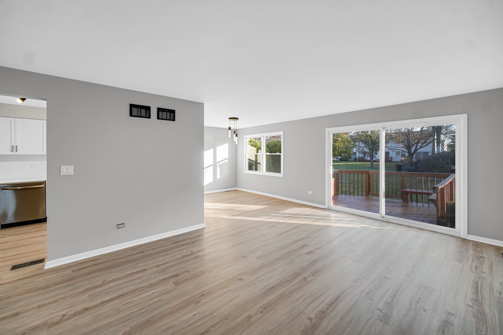 6827 Sussex Road Tinley Park, IL 60477 - Photo 7 of 27 a view of empty room with wooden floor and fan