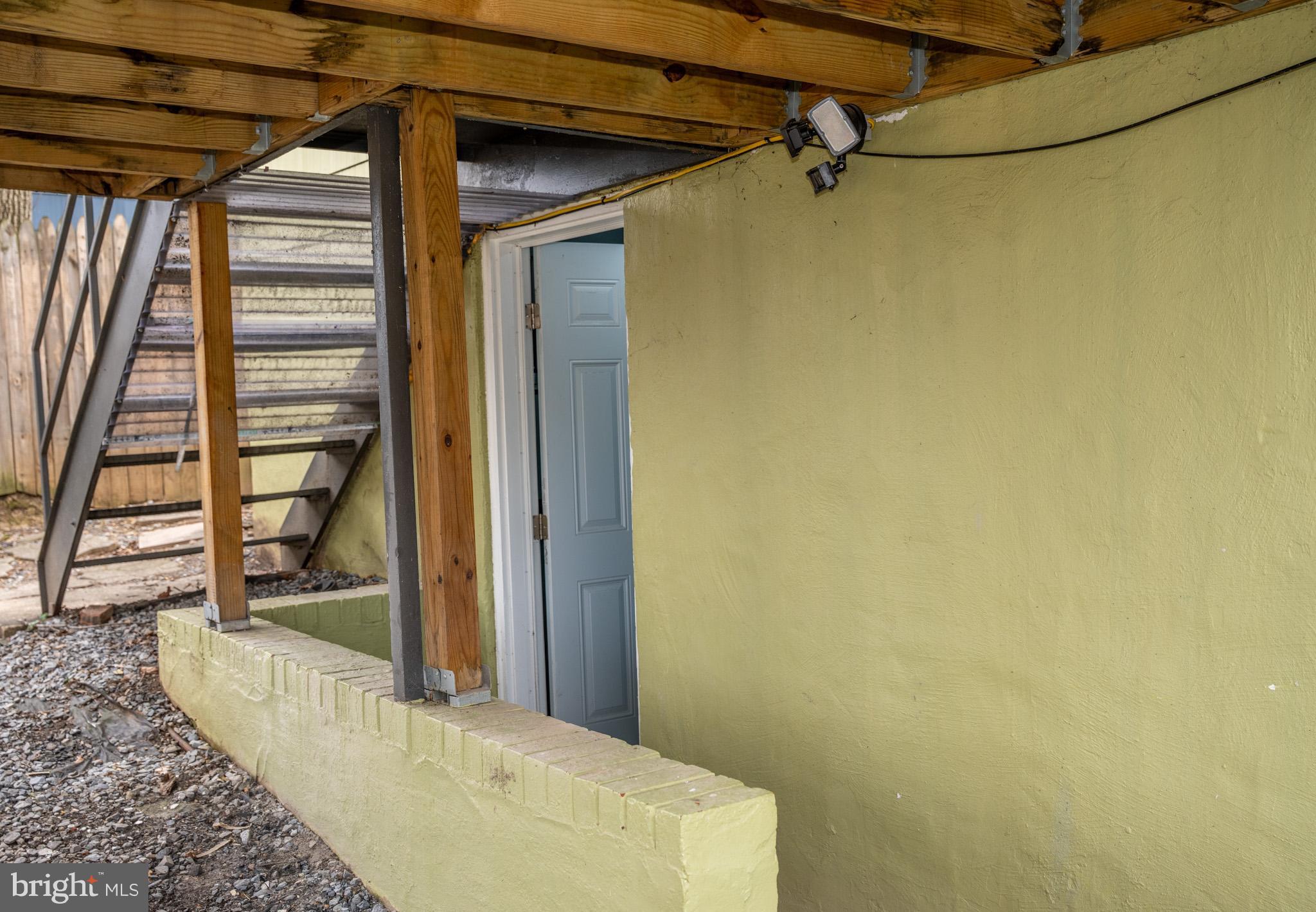 6304 Somerset Road Riverdale, MD 20737 - Photo 19 of 22 a view of a room with wooden floor and windows