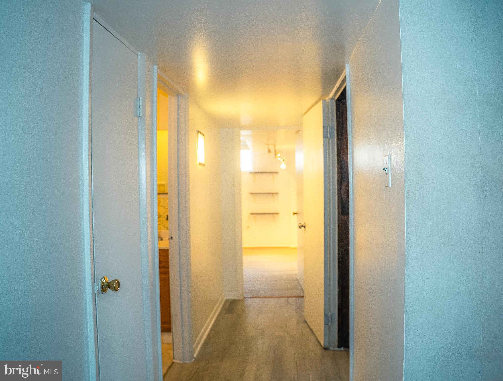 6304 Somerset Road Riverdale, MD 20737 - Photo 2 of 22 a view of a bathroom from a hallway