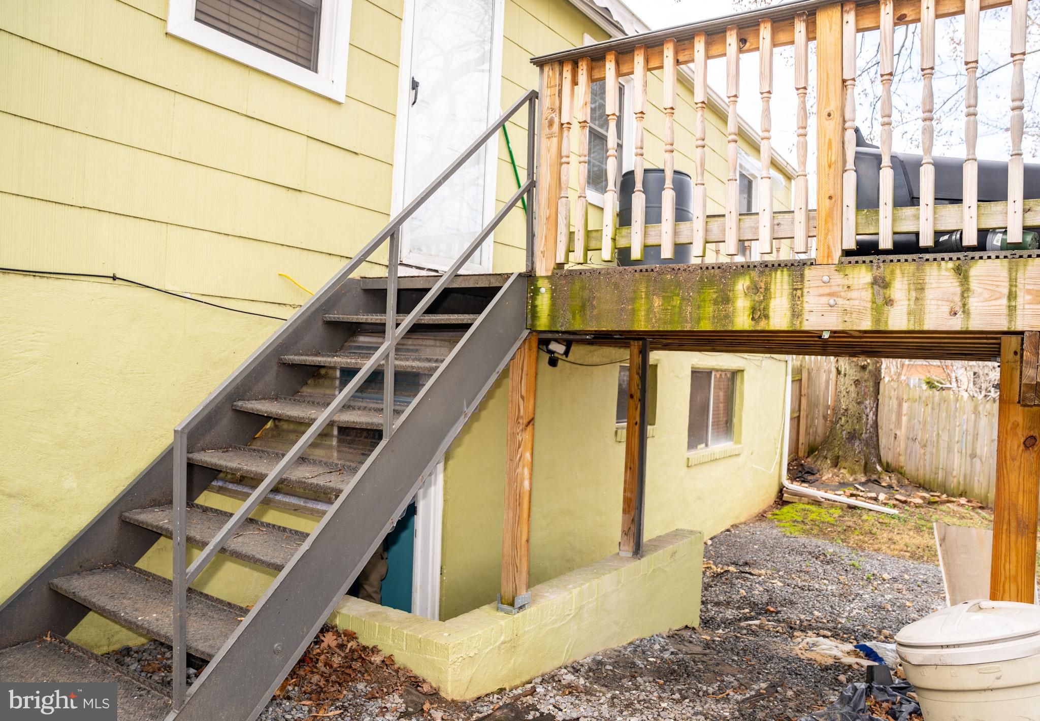 6304 Somerset Road Riverdale, MD 20737 - Photo 22 of 22 a view of a balcony with wooden floor and fence