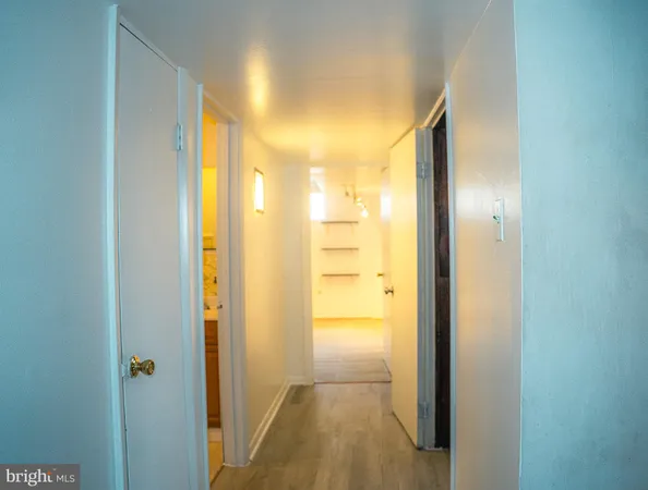 a view of a bathroom from a hallway