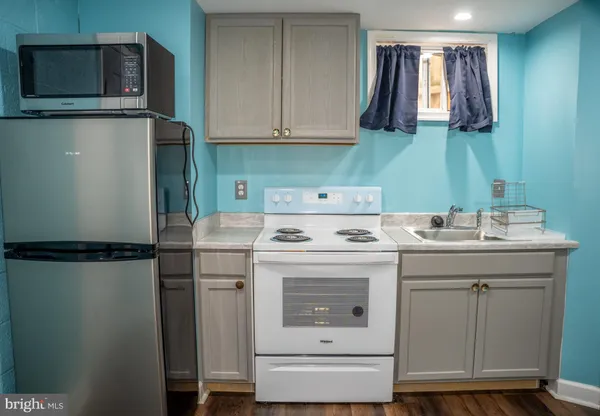 a kitchen with a sink and a microwave