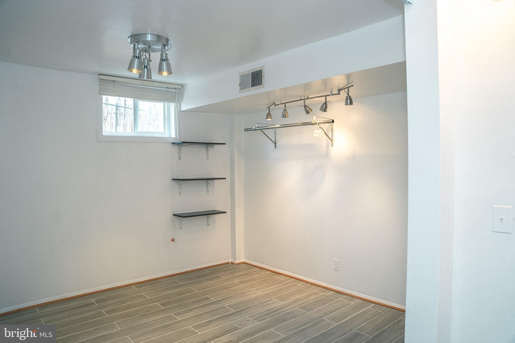 6304 Somerset Road Riverdale, MD 20737 - Photo 8 of 22 a view of walk in closet with window