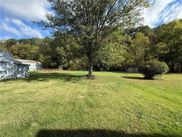 a backyard of a house with lots of green space