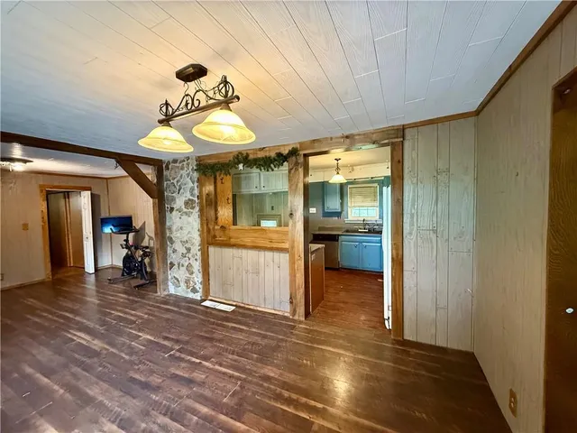 a large kitchen with stainless steel appliances granite countertop a sink and cabinets