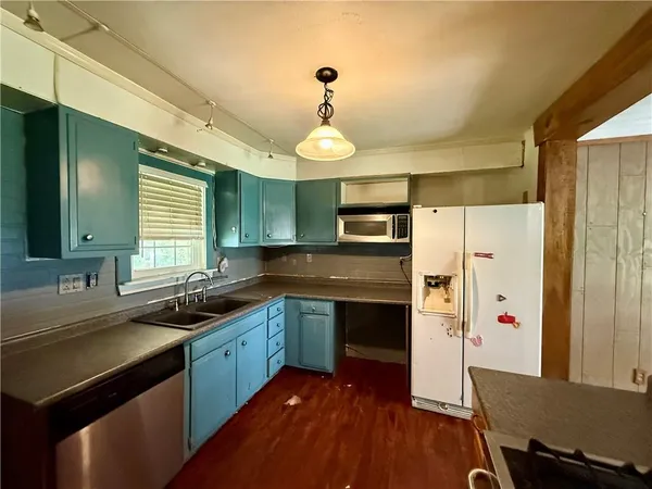 a view of wooden floor with a window