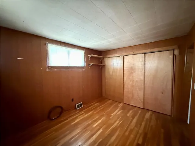 a bathroom with a bathtub toilet and window