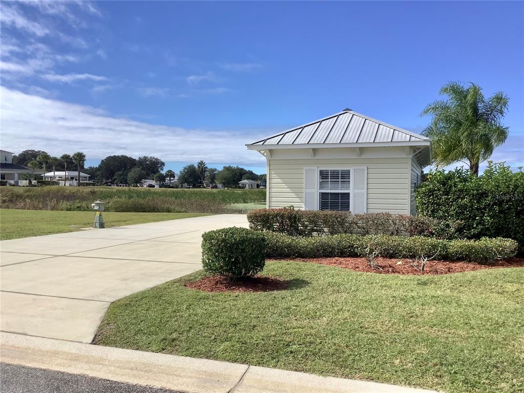 9540 Southeast 49th Terrace Webster, FL 33597 - Photo 1 of 1 a front view of a house with garden