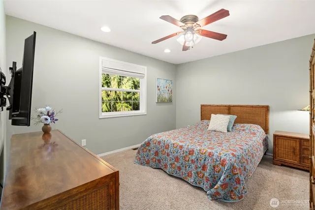 a bathroom with a granite countertop shower sink and mirror