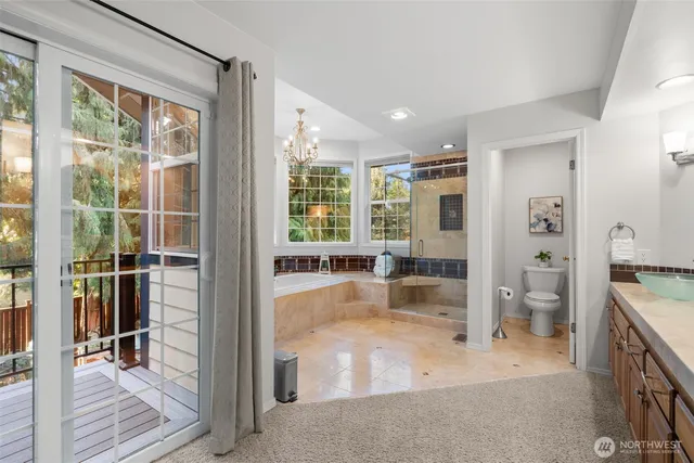 a view of a balcony with wooden floor and outdoor seating