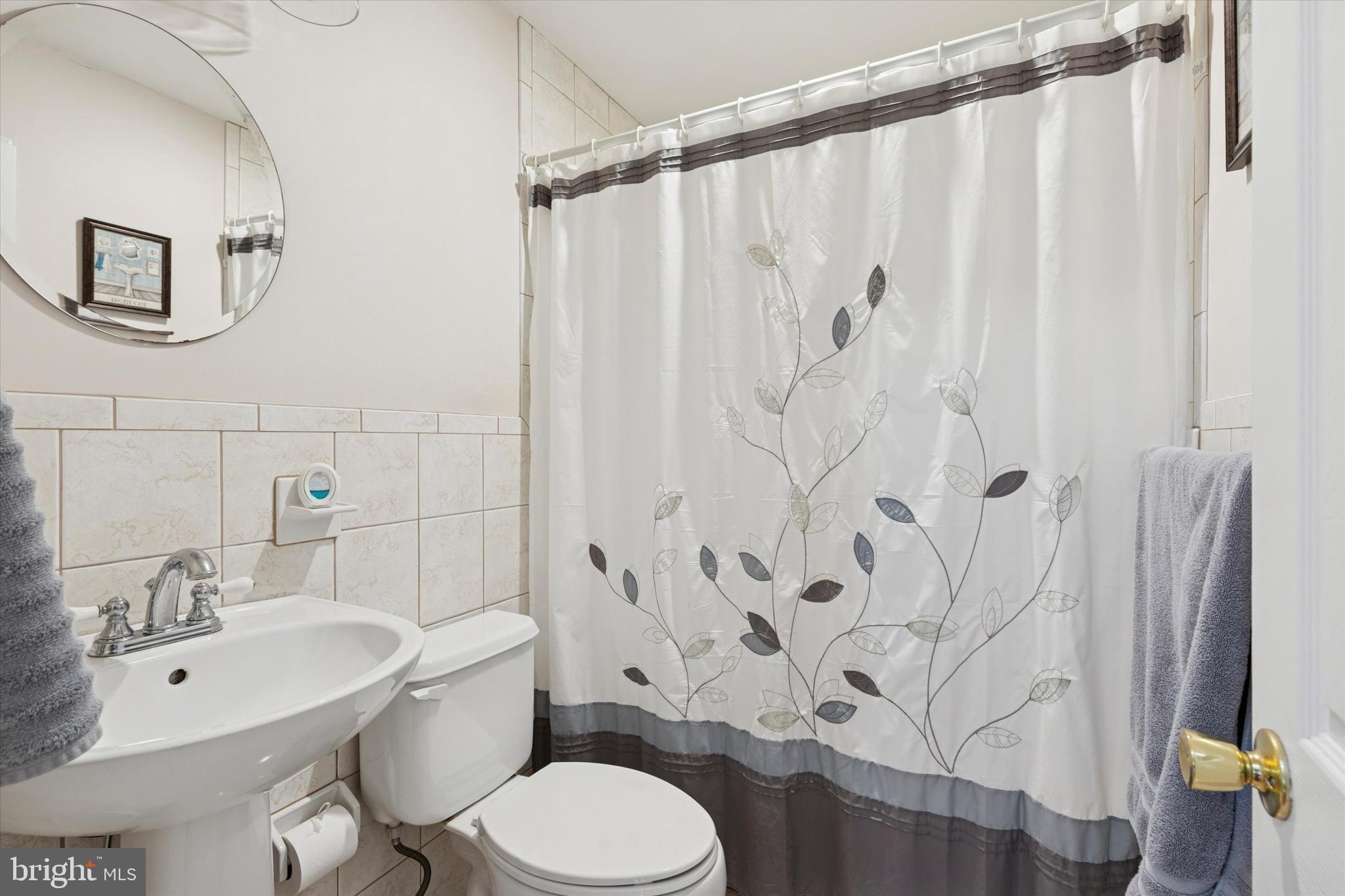 2718 Hawthorne Road Glenside, PA 19038 - Photo 12 of 23 a white toilet sitting next to a bathroom sink