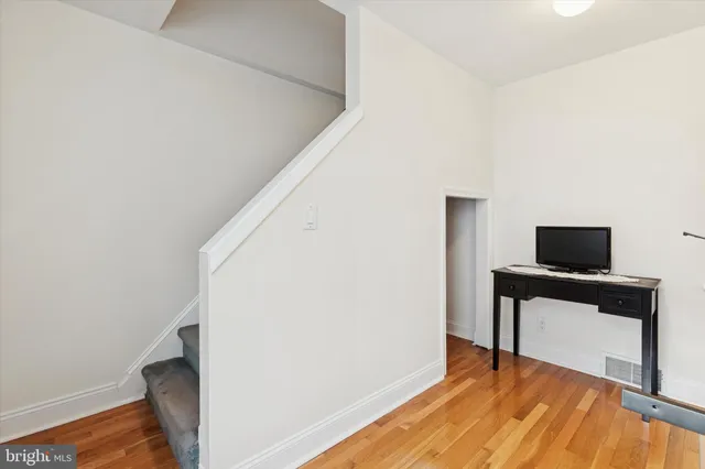 a view of workspace with wooden floor and chair