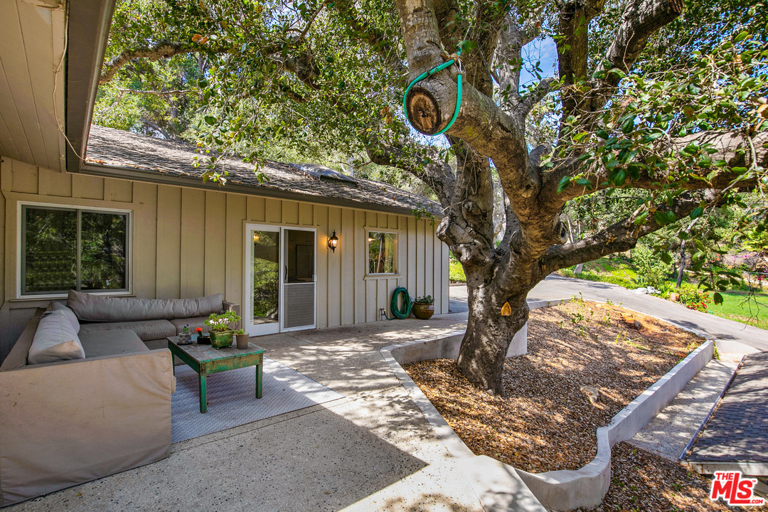 6133 Ramirez Canyon Road Malibu, CA 90265 - Photo 18 of 53 a view of a couches in the patio and a man seat