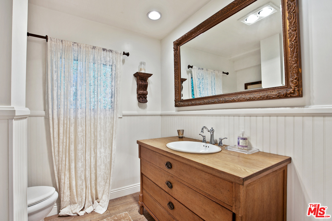 6133 Ramirez Canyon Road Malibu, CA 90265 - Photo 20 of 53 a bathroom with a sink and a mirror