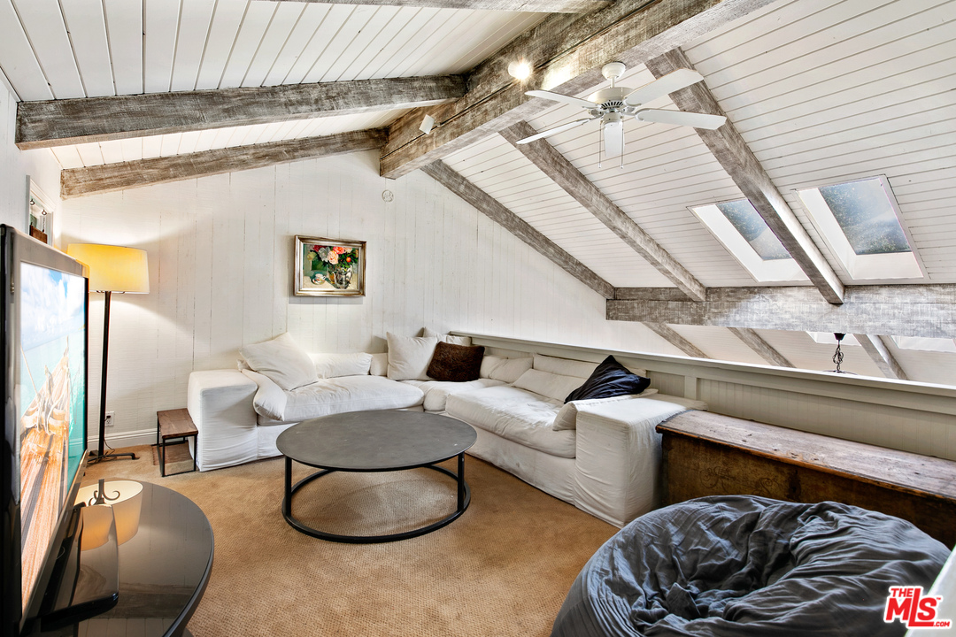 6133 Ramirez Canyon Road Malibu, CA 90265 - Photo 23 of 53 a living room with furniture and a rug