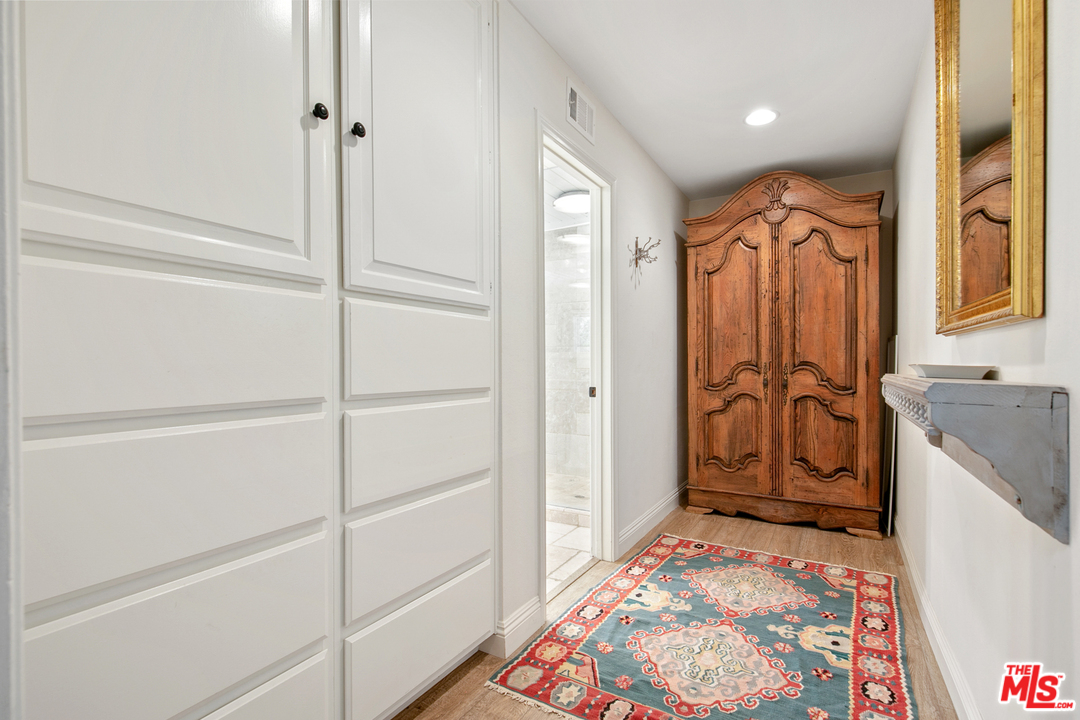 6133 Ramirez Canyon Road Malibu, CA 90265 - Photo 27 of 53 a bathroom with a granite countertop sink a mirror and a shower