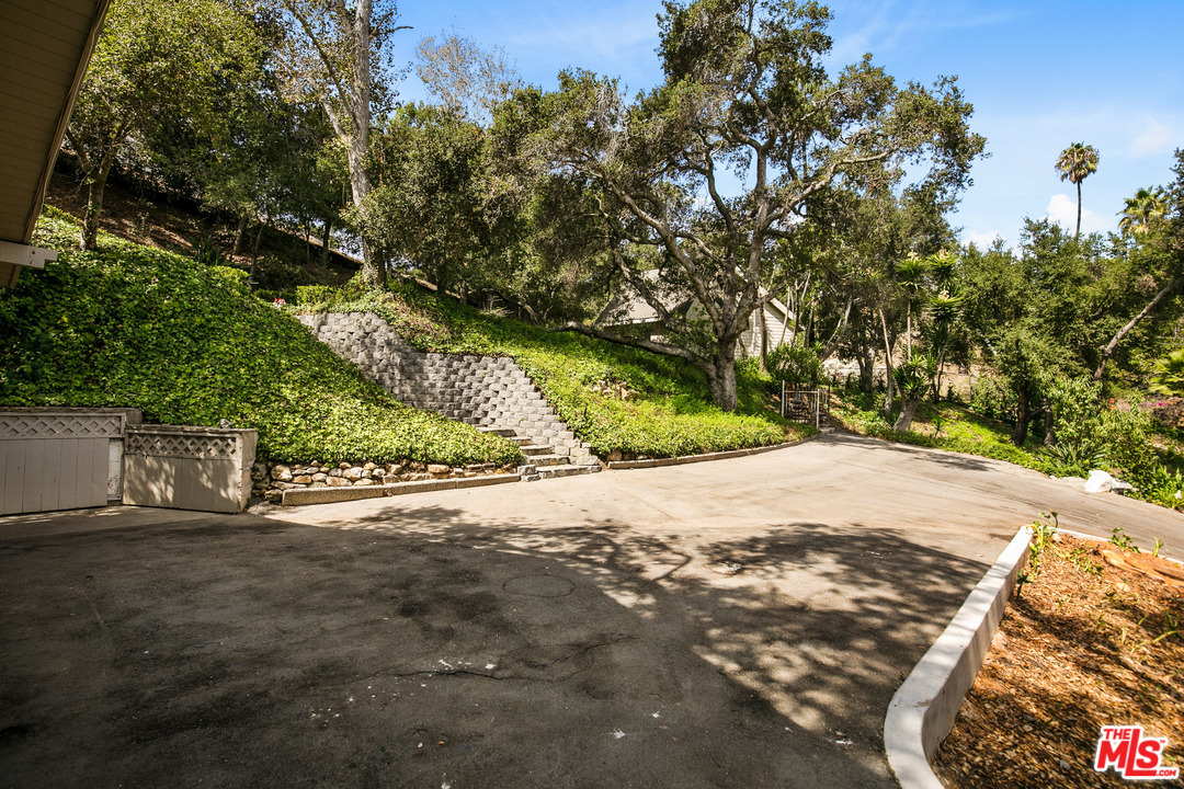 6133 Ramirez Canyon Road Malibu, CA 90265 - Photo 35 of 53 a view of a road with a tree
