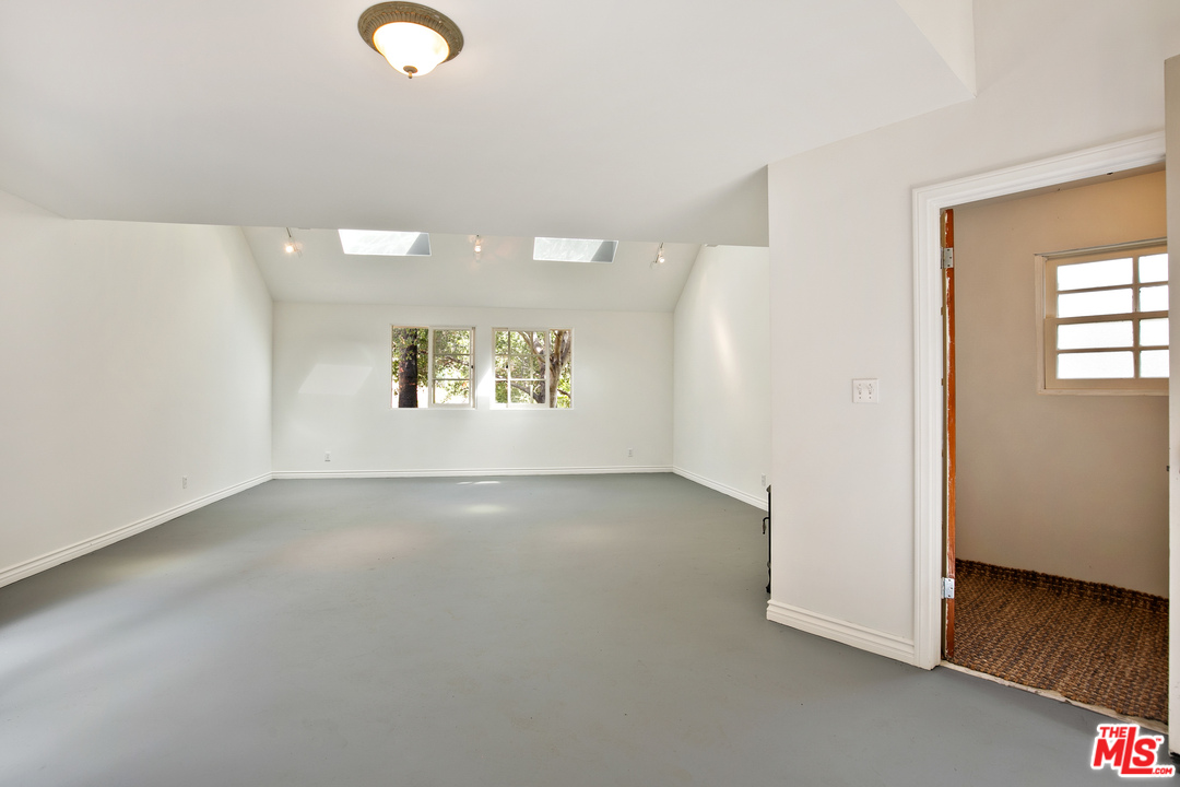6133 Ramirez Canyon Road Malibu, CA 90265 - Photo 42 of 53 an empty room with windows