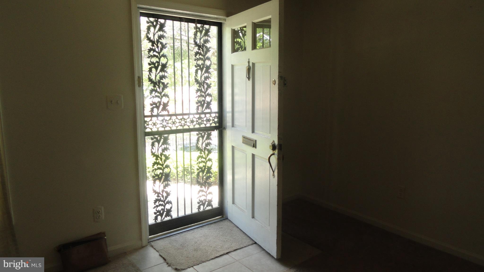 1911 Addison Road South District Heights, MD 20747 - Photo 2 of 15 a view of an front door