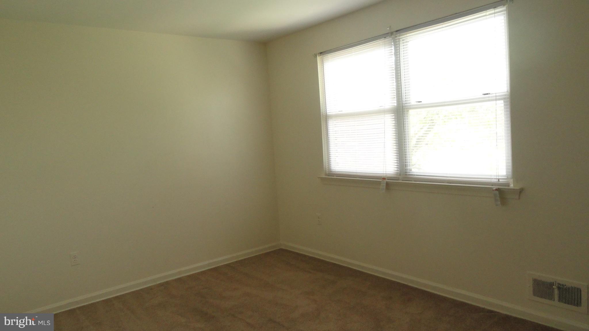 1911 Addison Road South District Heights, MD 20747 - Photo 3 of 15 an empty room with a window