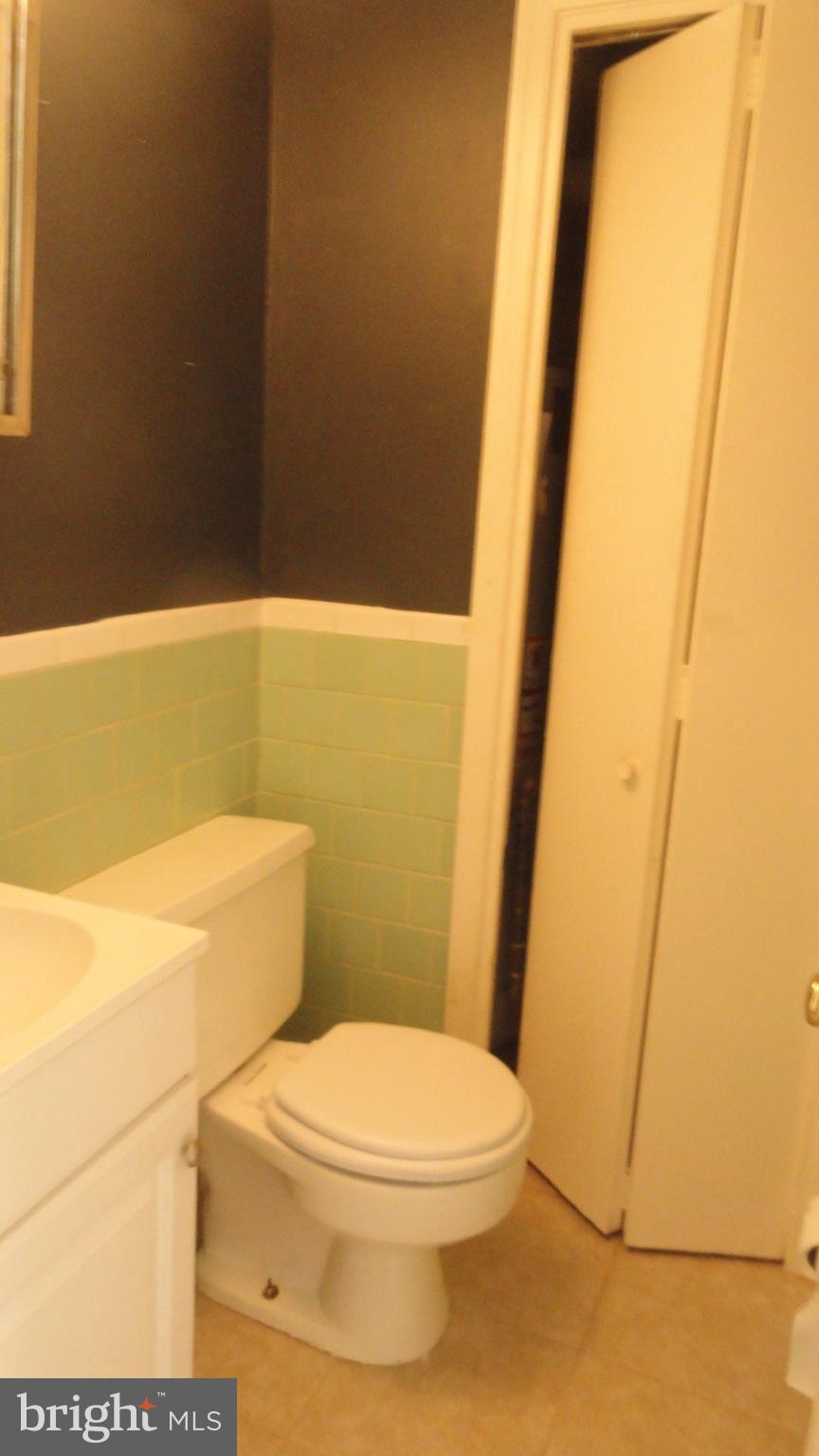 1911 Addison Road South District Heights, MD 20747 - Photo 10 of 15 a white toilet sitting next to a sink