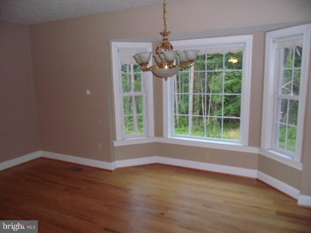 20140 Fort Valley Road Strasburg, VA 22657 - Photo 13 of 25 a view of wooden floor and windows in a room