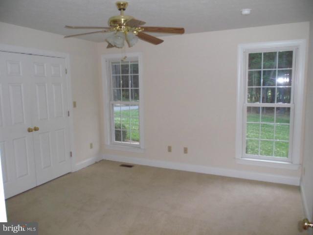20140 Fort Valley Road Strasburg, VA 22657 - Photo 14 of 25 an empty room with windows and fan