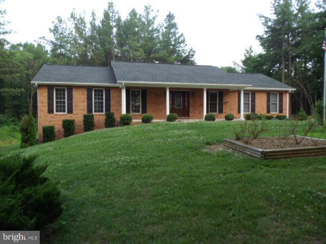20140 Fort Valley Road Strasburg, VA 22657 - Photo 25 of 25 a front view of a house with a garden and trees