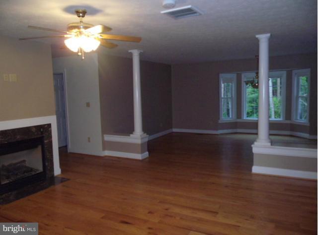 20140 Fort Valley Road Strasburg, VA 22657 - Photo 5 of 25 a view of a livingroom with wooden floor a fireplace and window