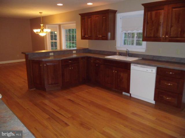 20140 Fort Valley Road Strasburg, VA 22657 - Photo 6 of 25 a kitchen with a sink cabinets and wooden floor