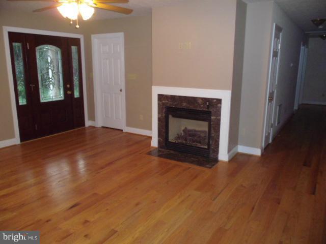 20140 Fort Valley Road Strasburg, VA 22657 - Photo 10 of 25 a view of an empty room with window and wooden floor