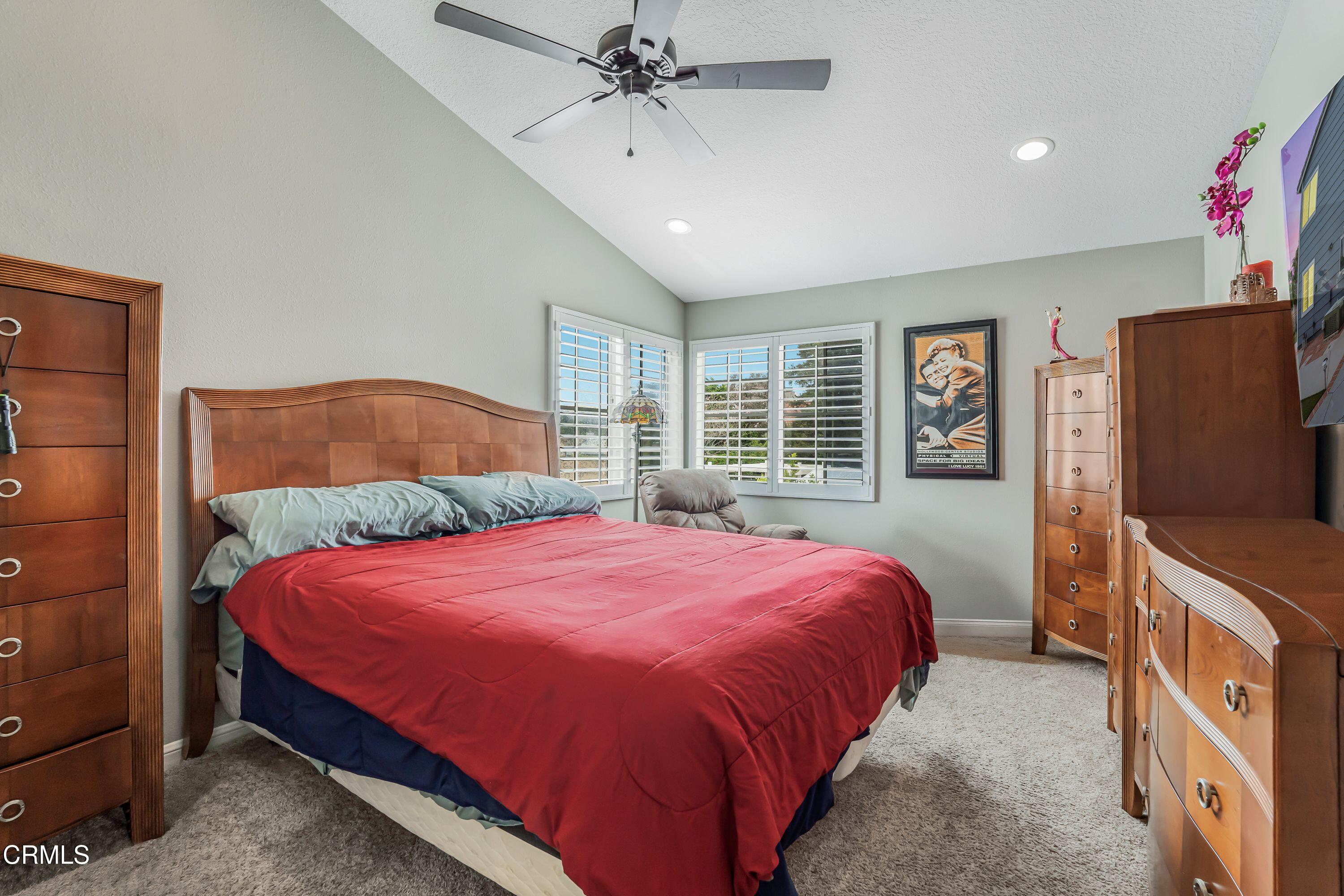 2752 Lemon Drive Simi Valley, CA 93063 - Photo 14 of 31 a bedroom with a large bed and a chandelier