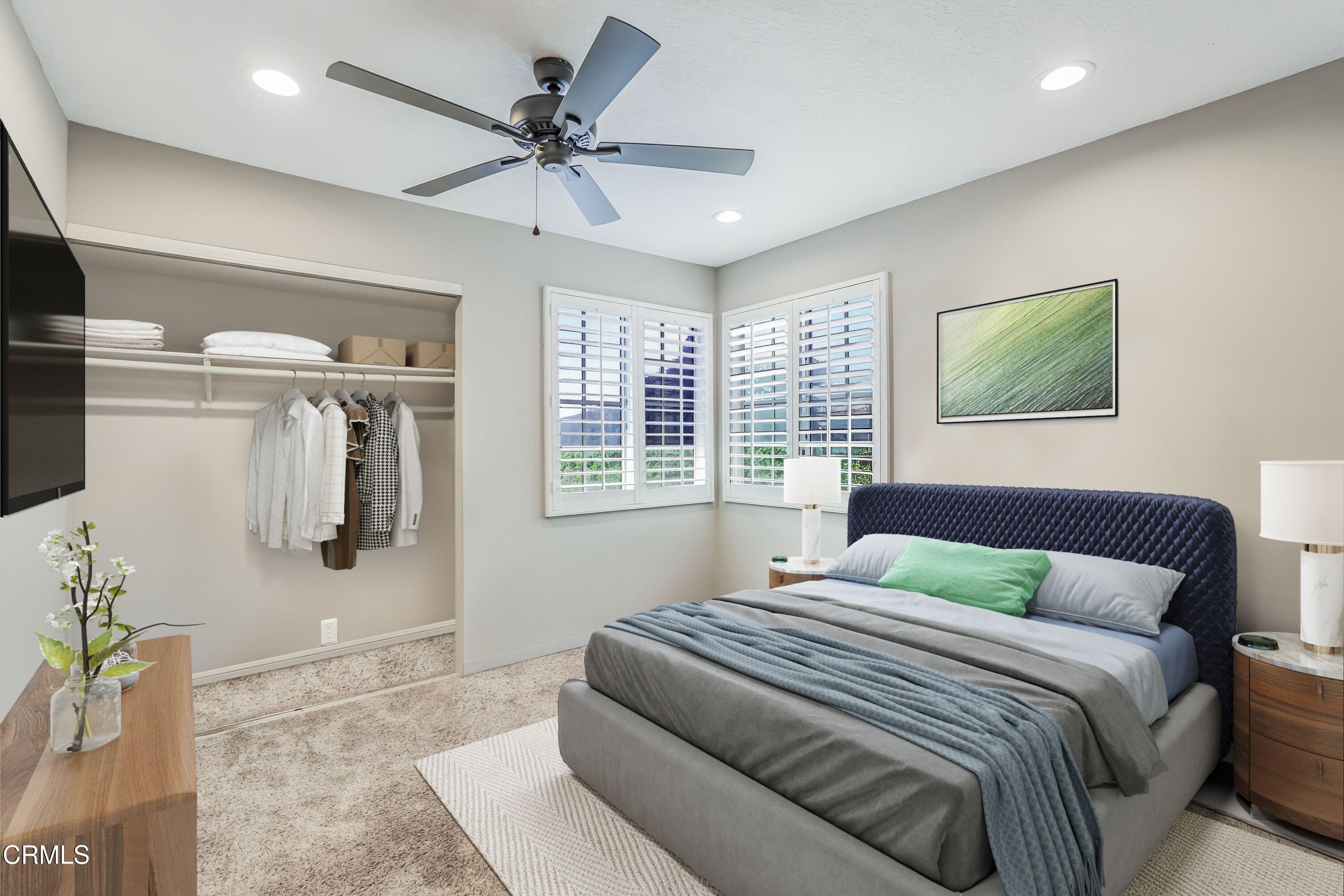 2752 Lemon Drive Simi Valley, CA 93063 - Photo 17 of 31 a bedroom with a large bed a chandelier and window