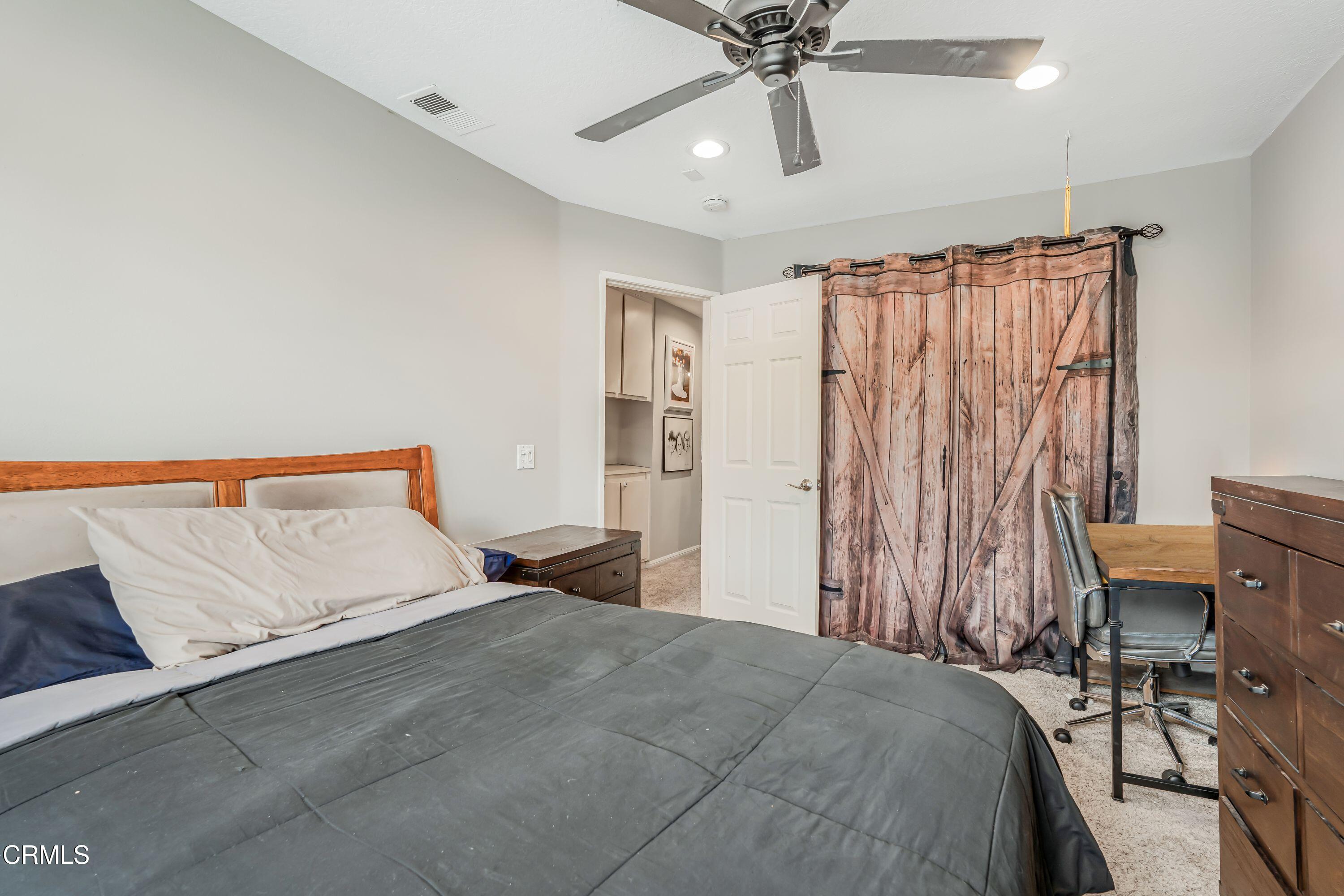 2752 Lemon Drive Simi Valley, CA 93063 - Photo 20 of 31 a bedroom with a bed and a chandelier