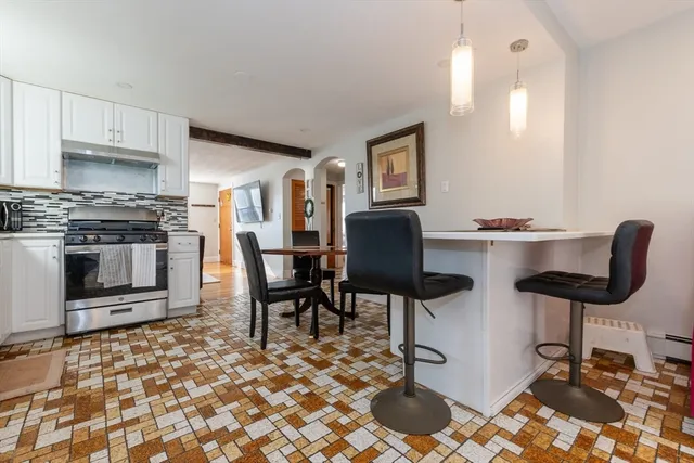 a workspace with furniture and a fireplace