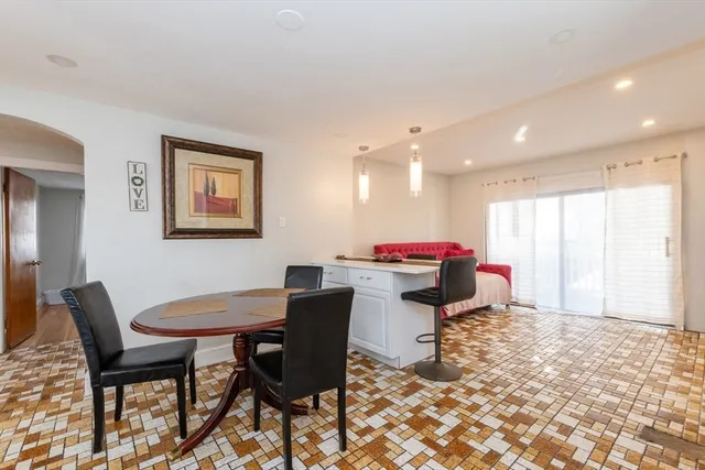 a dining room with a table and chairs