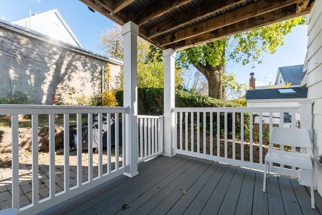 a view of a two chairs in the balcony