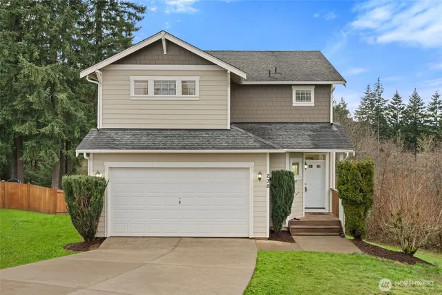 a front view of house with yard and green space