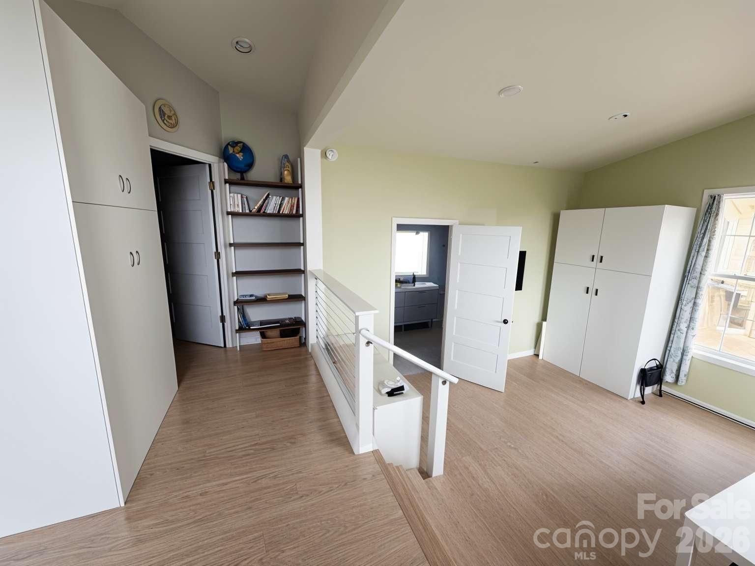 3445 Irish Hills Road Morganton, NC 28655 - Photo 18 of 34 wooden floor in an empty room with a window