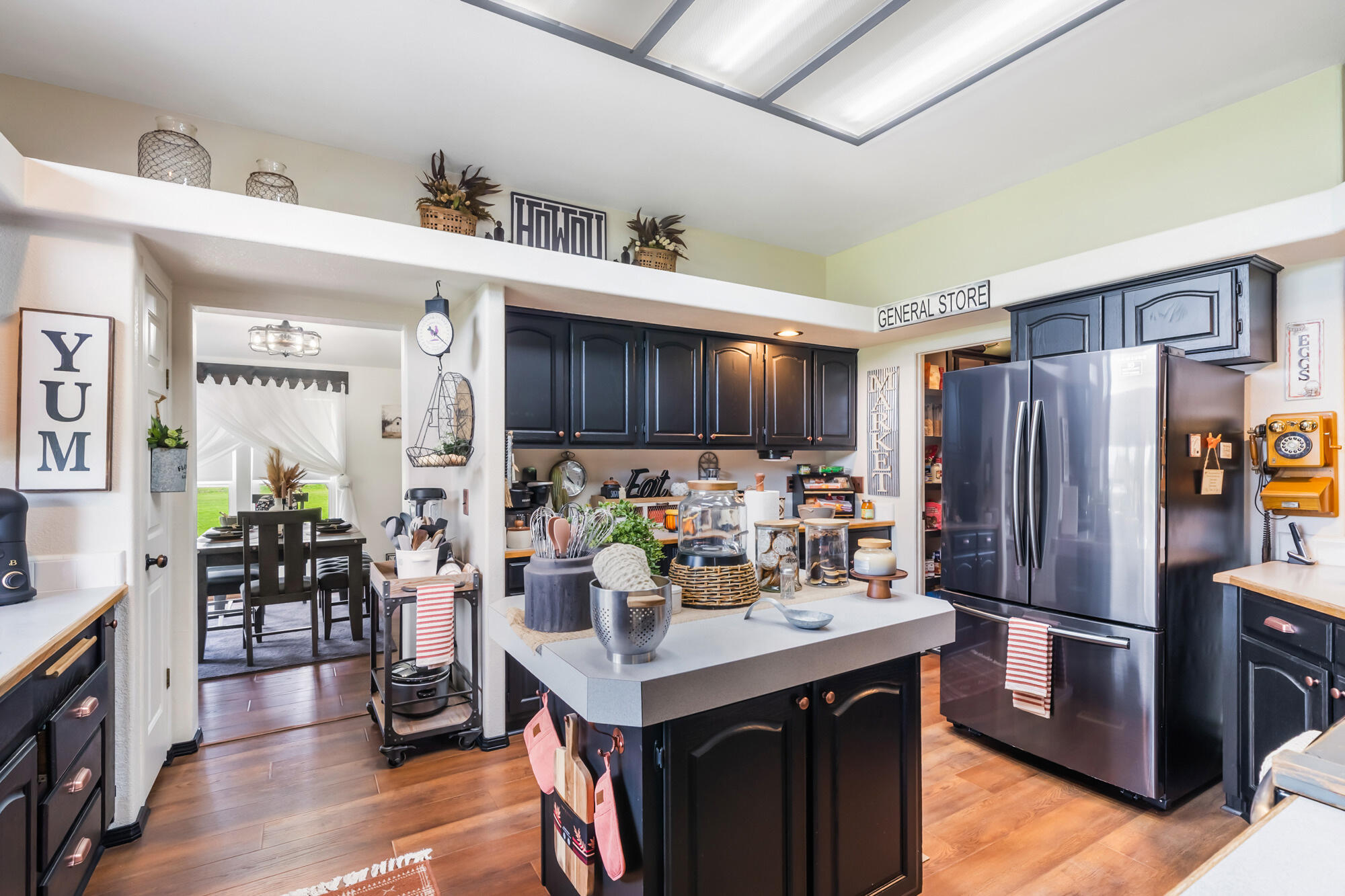 7400 South Prairie Road Tillamook, OR 97141 - Photo 11 of 62 a kitchen with a refrigerator and a sink