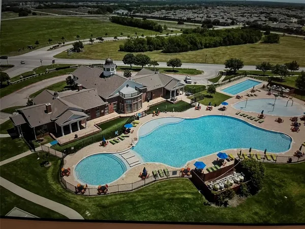 an aerial view of a house with outdoor space swimming pool and outdoor space