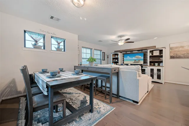 a bed room with bed and a large window