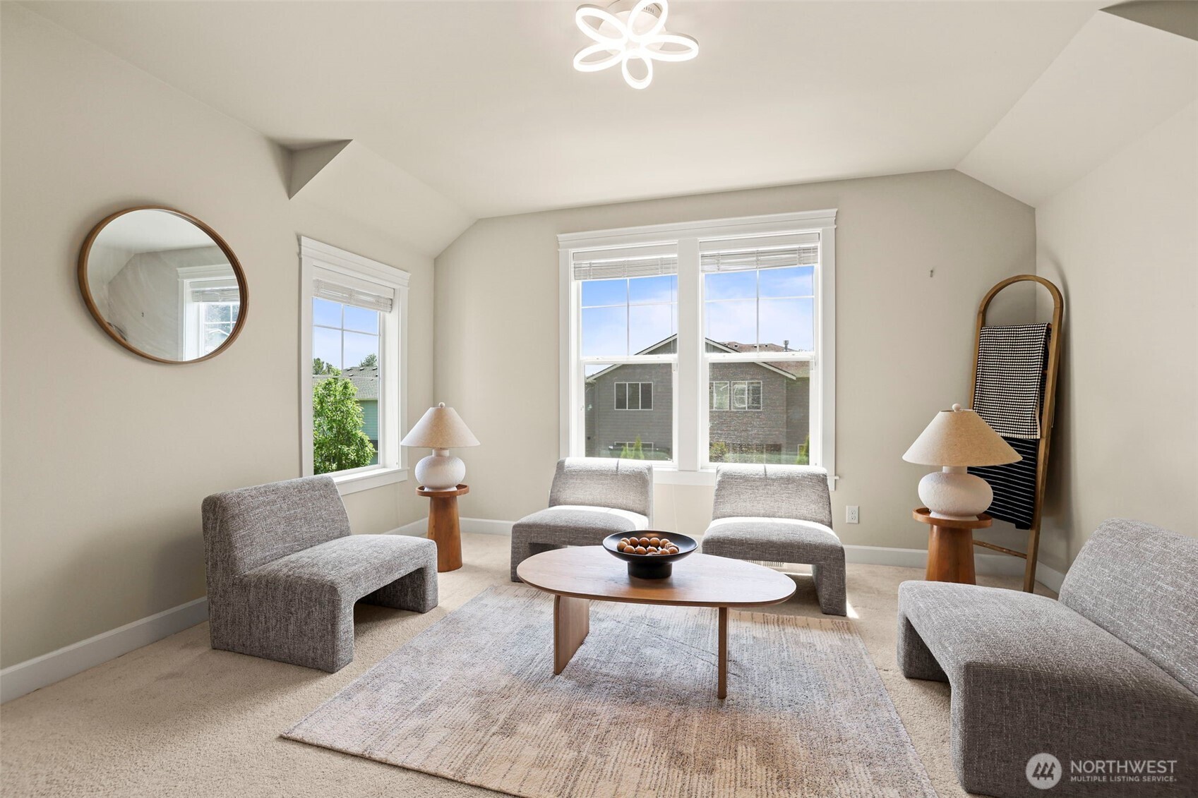 29 242nd Street Southeast Bothell, WA 98021 - Photo 16 of 40 a living room with furniture a table and a large window