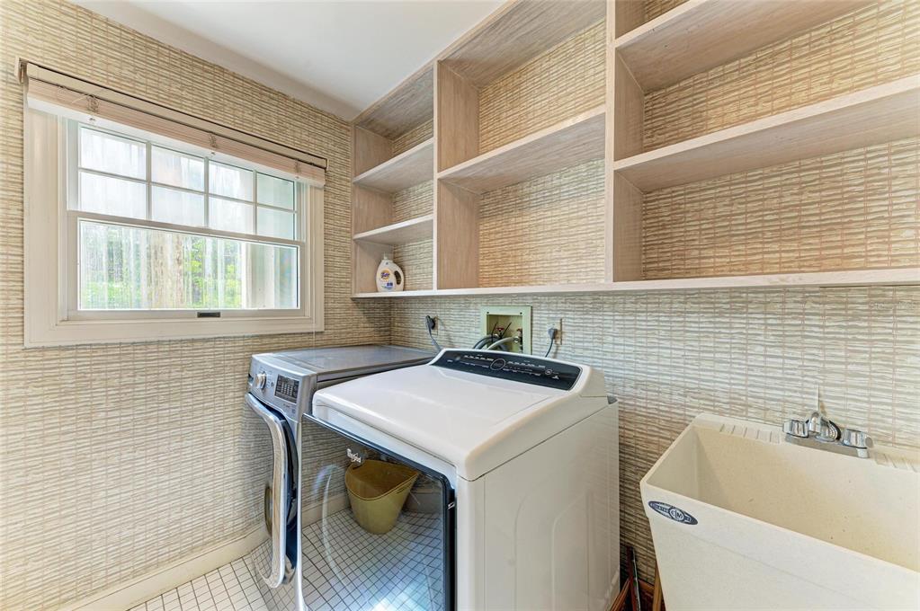 4473 Gulf Of Mexico Drive, Unit 4473 Longboat Key, FL 34228 - Photo 16 of 50 a utility room with dryer and washer